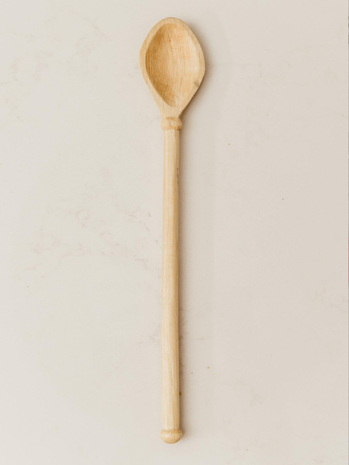 Small wooden spoon on table