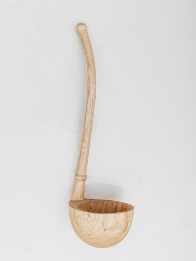 wooden ladle sitting on table