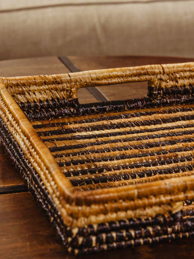 Brown woven square basket on a brown table