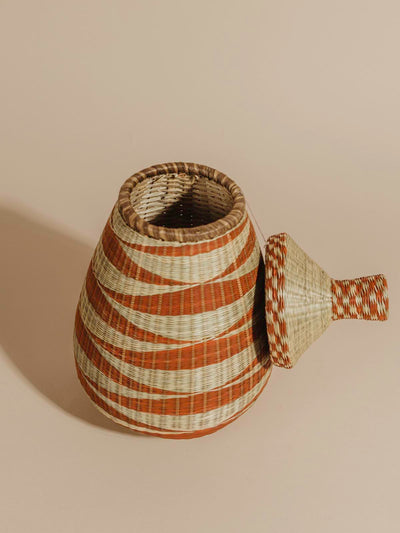 Tan and orange woven basket with top off