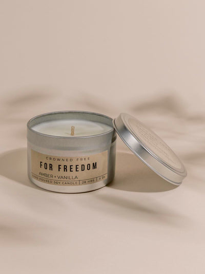 Crowned free candle on beige background
