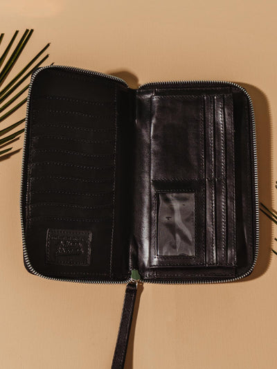 The inside of the black rani wallet. Multiple card holders and Pockets for easy storage. Silver detailing and zipper for easy open and close