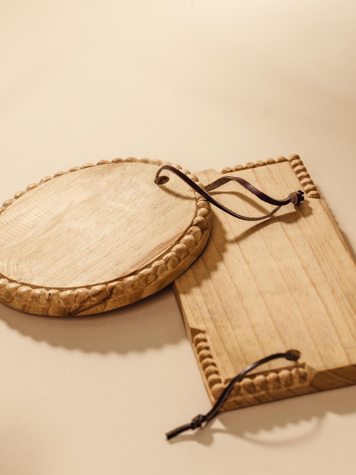 Round and Rectangle wooden serving tray on beige background