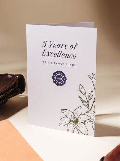 5 years of excellence gifting card example on cream background.