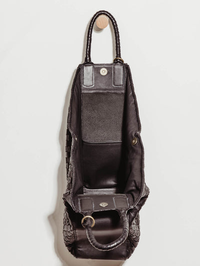 open view of black leather all day tote to show interior size and leather pockets.