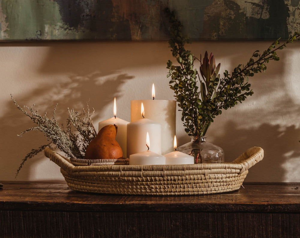 Hand woven basket with 5 lit candles 
