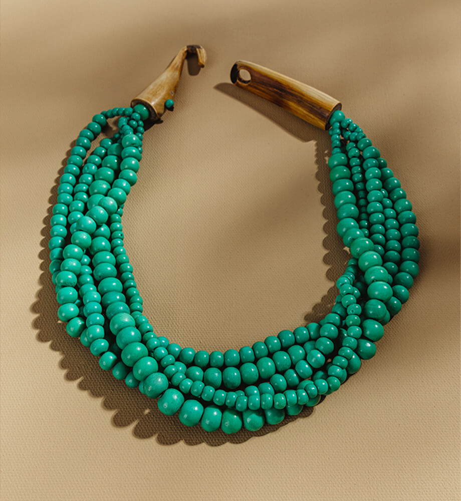 peacock green hand crafted bone beaded necklace with natural bone clasp
