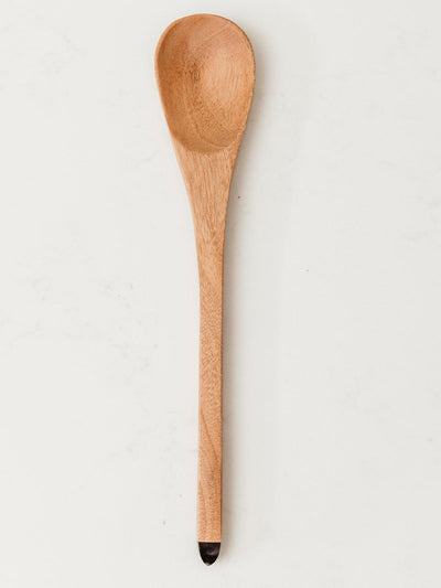 Serving spoon on white counter.