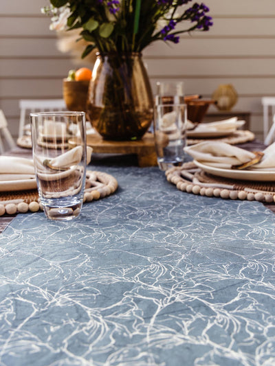 Details of hibiscus table runner on an outdoor with full table setting