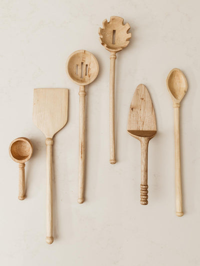Coffee scoop seen with entire kitchen utensils set.
