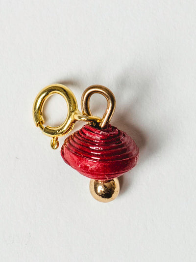 Ruby red bead charm on gold clasp. 