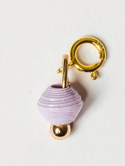 Lavender bead charm on gold clasp. 