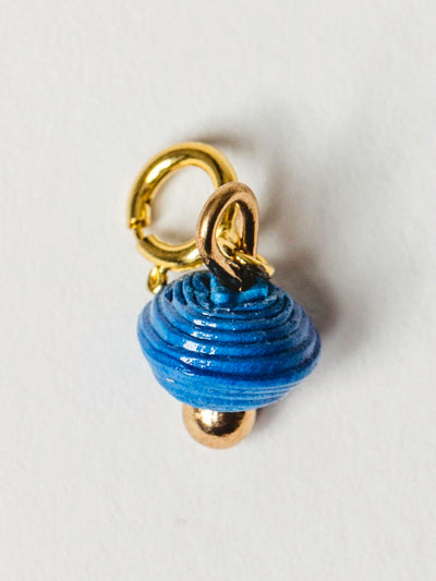 True  blue bead charm on gold clasp. 