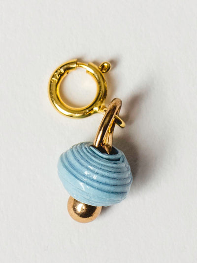 cloudy blue bead charm on gold clasp. 