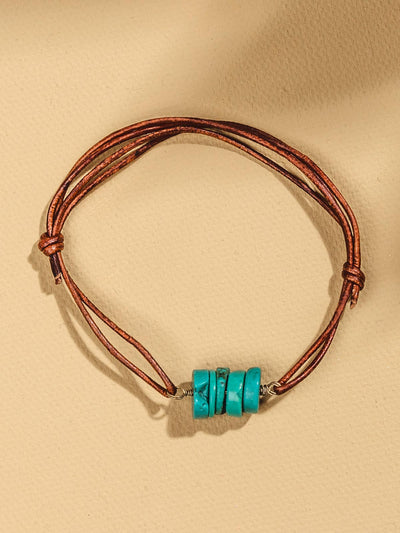 Leather adjustable bracelet with turquoise beads.