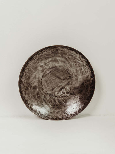Hammered metal bowl with shine and texture 