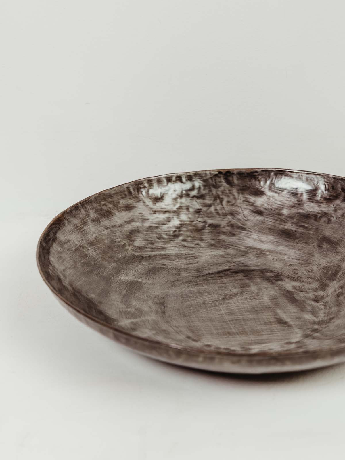 Hammered bowl at an angle to show shallow depth. 