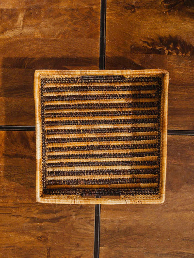 Square woven basket in square shape on brown table