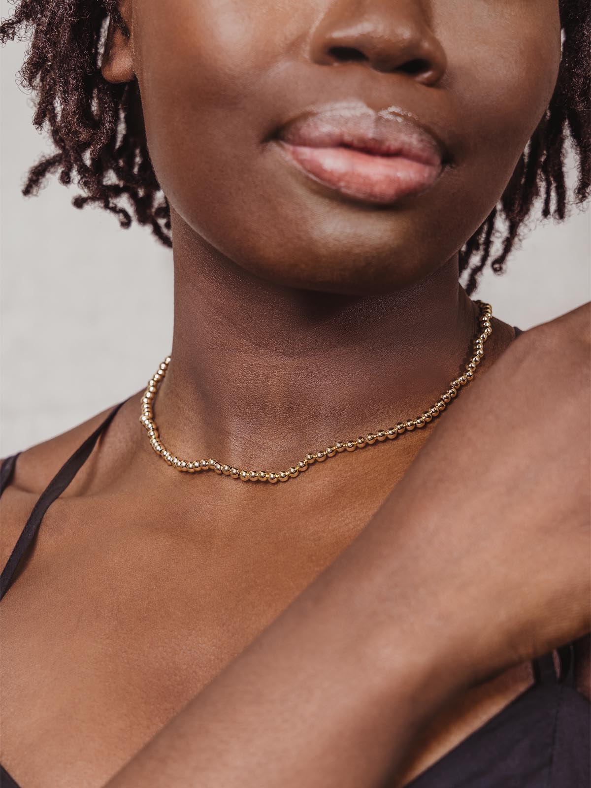 Gold Beaded Choker Close up on Woman
