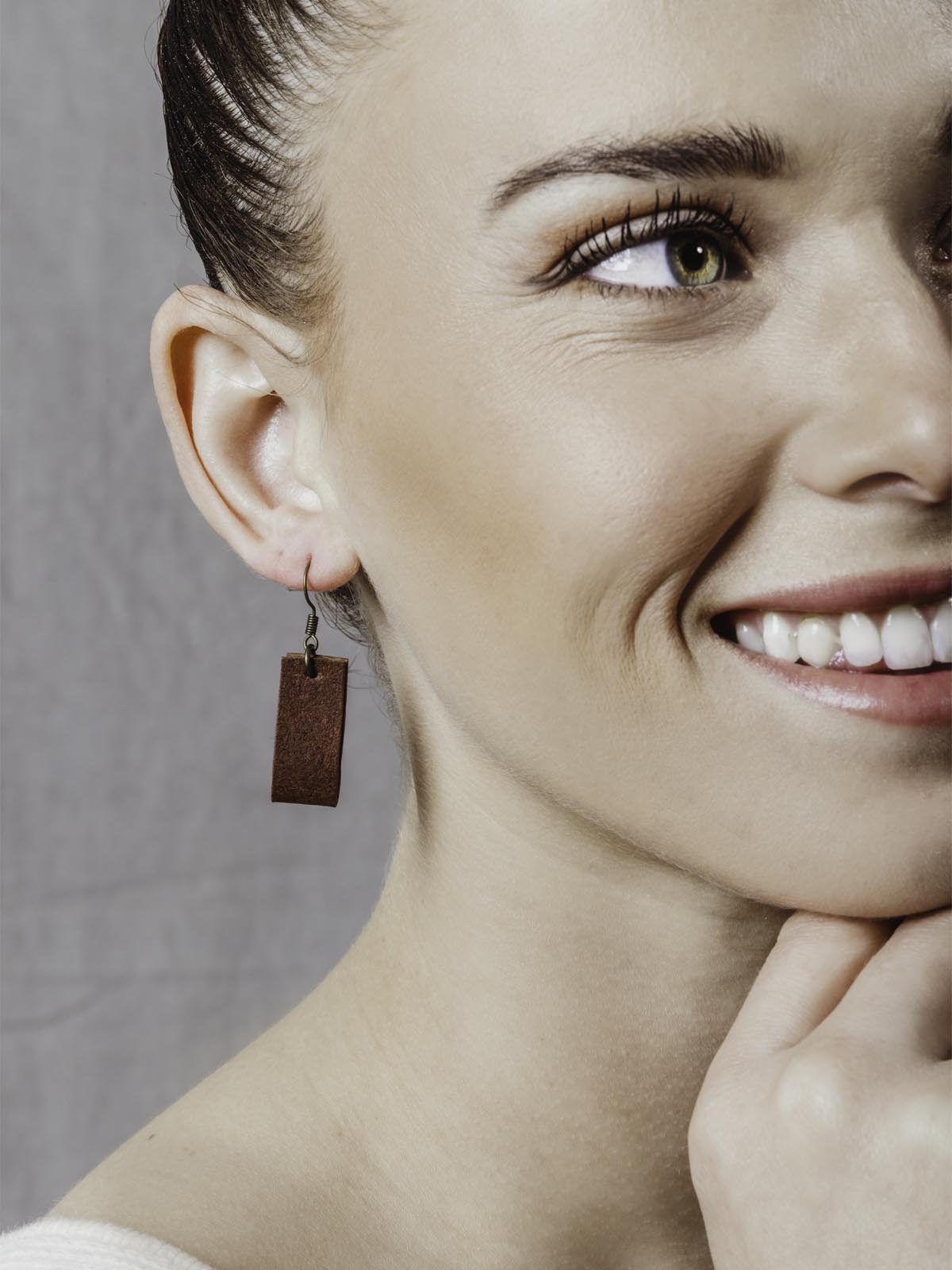 Model wearing Small looped rectangular leather earrings