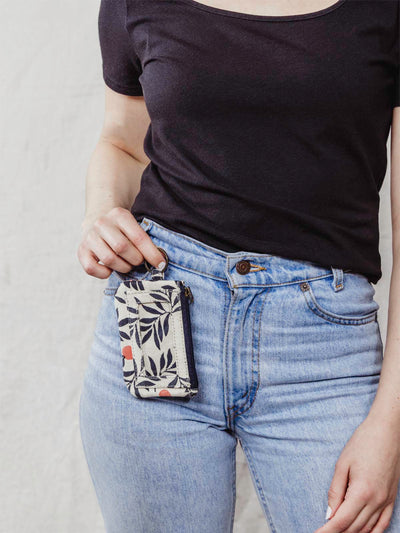 Model holding Berry print ID pouch