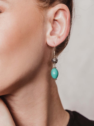 turquoise stone drop earrings with silver ornate ball