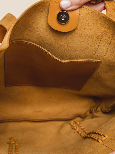 Inside details of bag featuring a handmade large pocket.