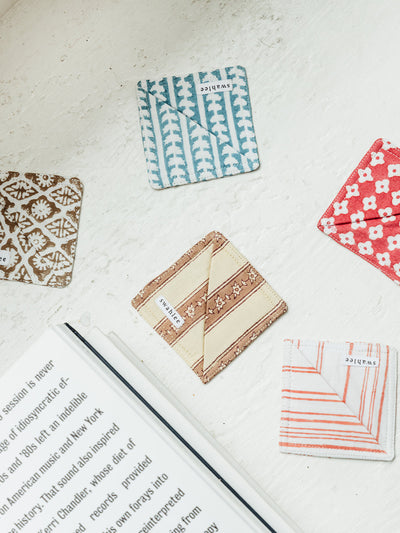 Green reusable fabric facial pads with matching green drawstring bag