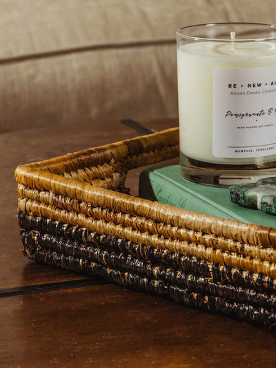 square basket on table with candle