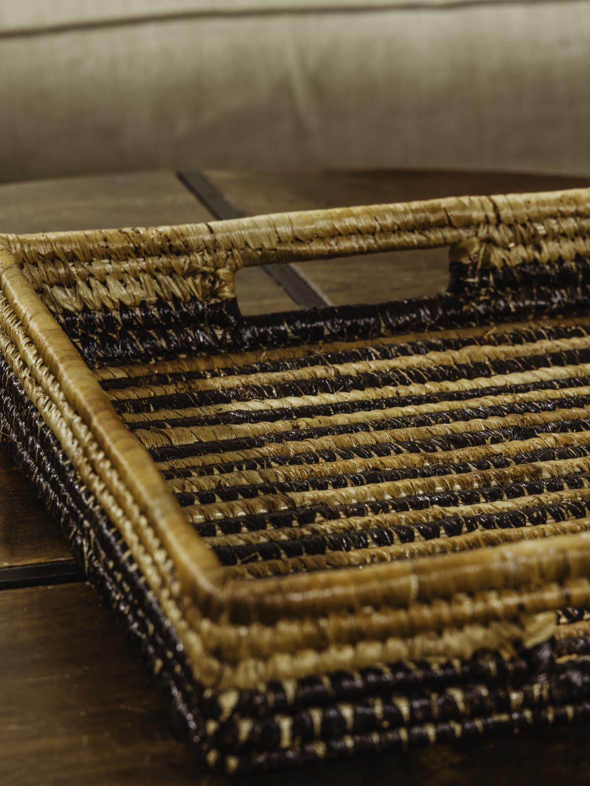 Brown woven square basket on a brown table