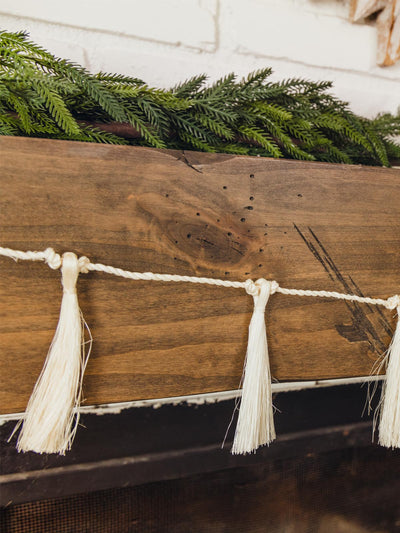 White tassel garland on mantle