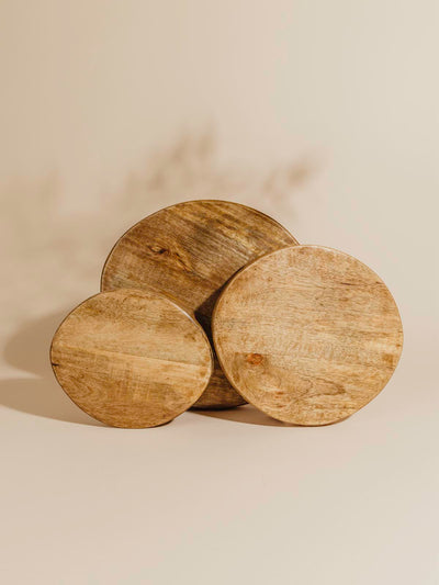 Mango wood trays placed on their side to show various surface area. 