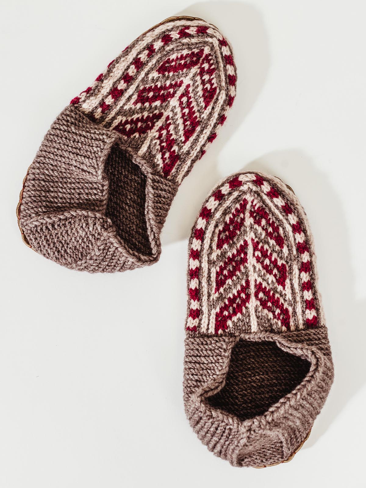 Men tope and red slipper socks on white background.