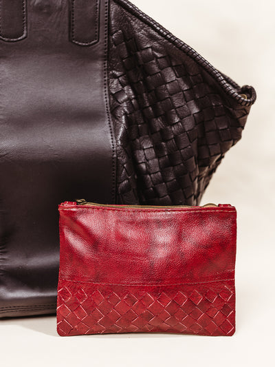  Small Leather Pouchette in Red on cream background with purse for scale.