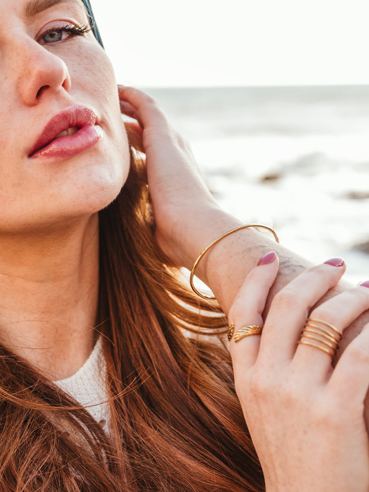 Female model wearing forai’s brass bangle band