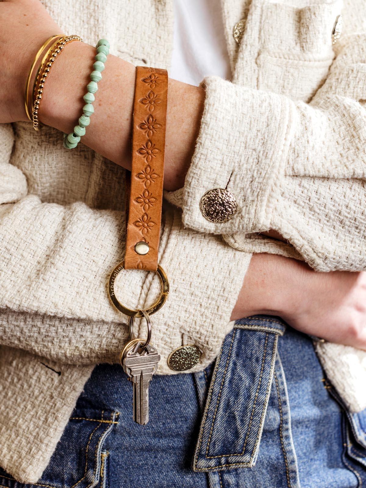 Hand Stamped Leather Keychain Wrestler on models hand with keys.