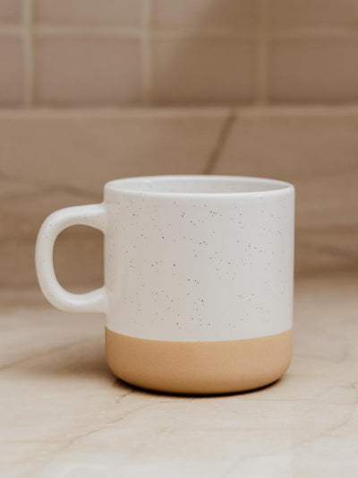 10 oz speckle ceramic mug on kitchen counter.