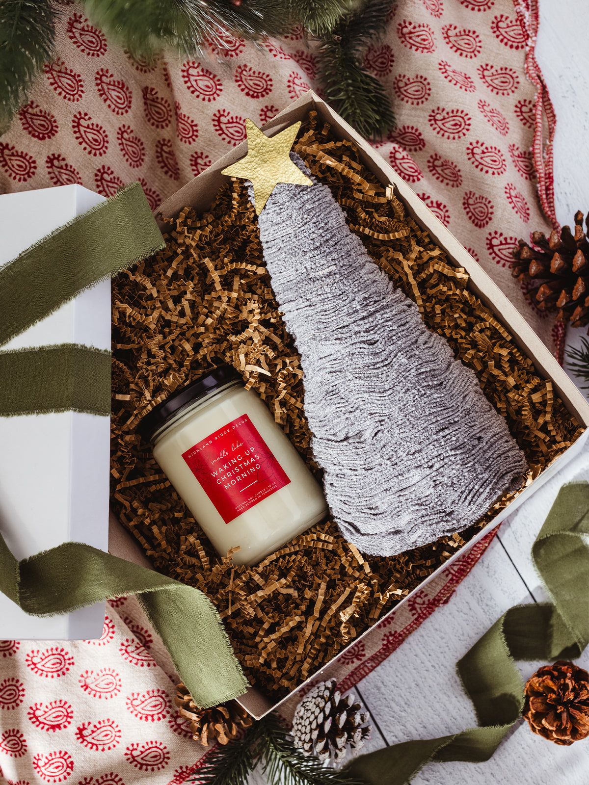 Christmas gift box with soy candle labeled “Waking Up Christmas Morning” and handmade gray yarn tree with gold star, eco-friendly holiday decor set