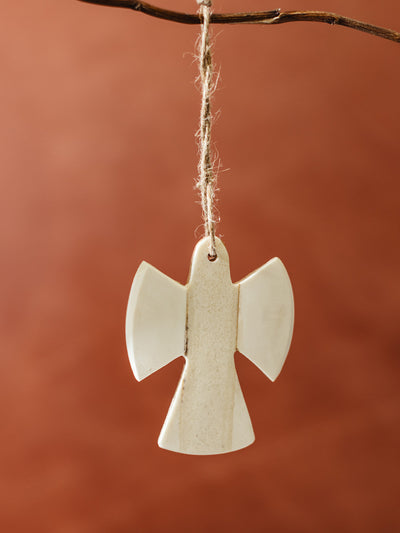 Ethically made bone angel ornament hanging on twine, fair trade holiday décor with simple and timeless Christmas design.