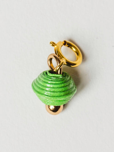 Bright green bead charm on gold clasp. 