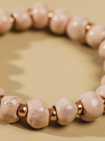 Pink and gold ceramic bead bracelet. 